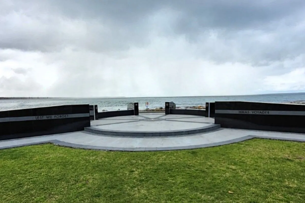 Coastal war memorial with Lest We Forget engraving