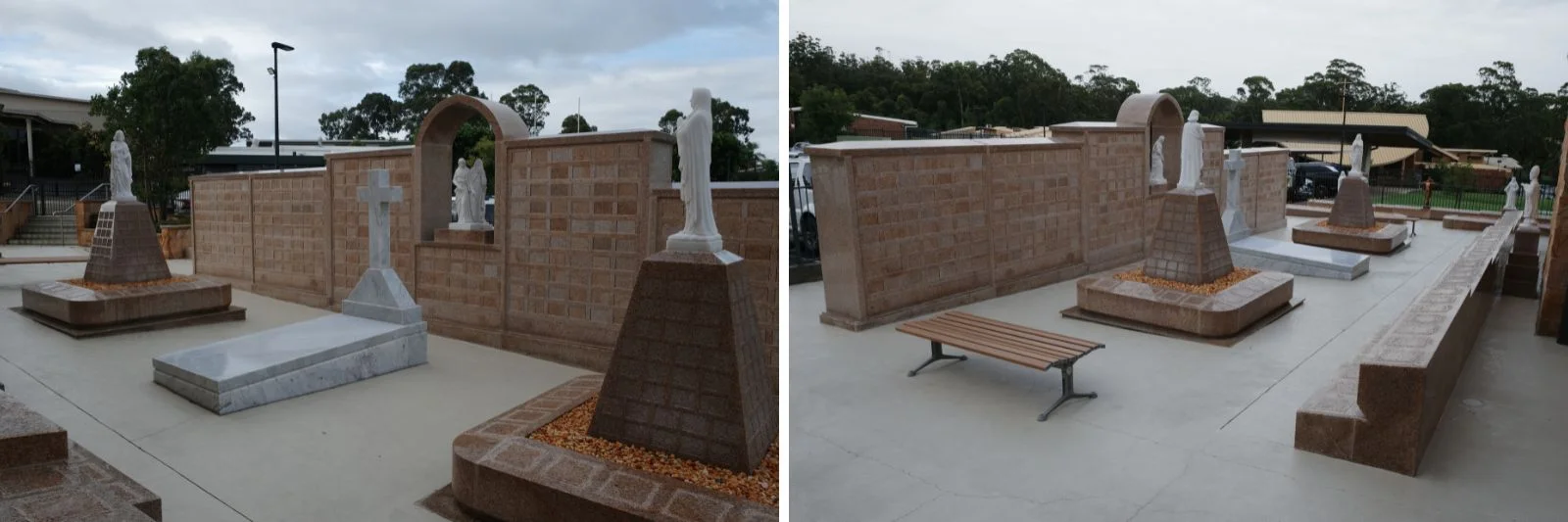 Landscaped columbarium memorial garden featuring stone niche walls, religious statues, and a central monument