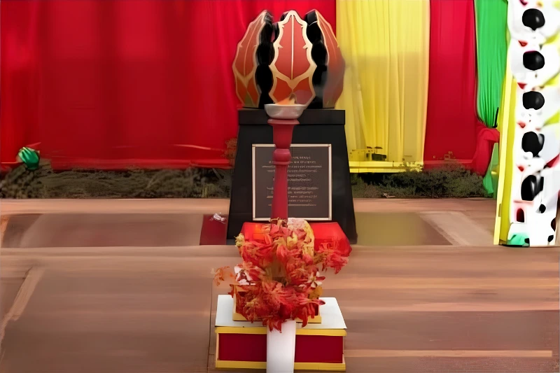 Floral tribute displayed in front of the Tamil Community Memorial monument.