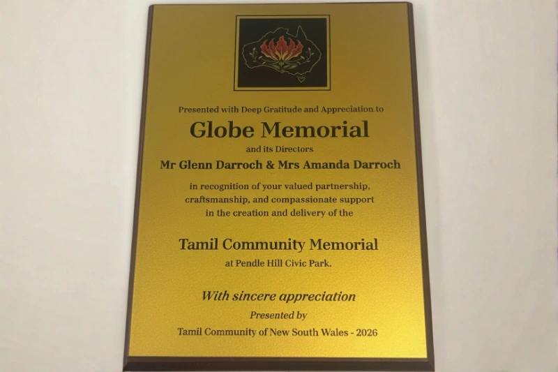 Gold commemorative plaque presented to Globe Memorial, recognising Glenn Darroch and Amanda Darroch for their partnership and support in creating the Tamil Community Memorial at Pendle Hill Civic Park.