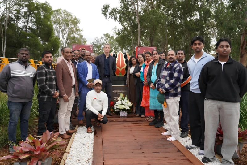 Group gathered in front of the Tamil Community Memorial in Sydney.
