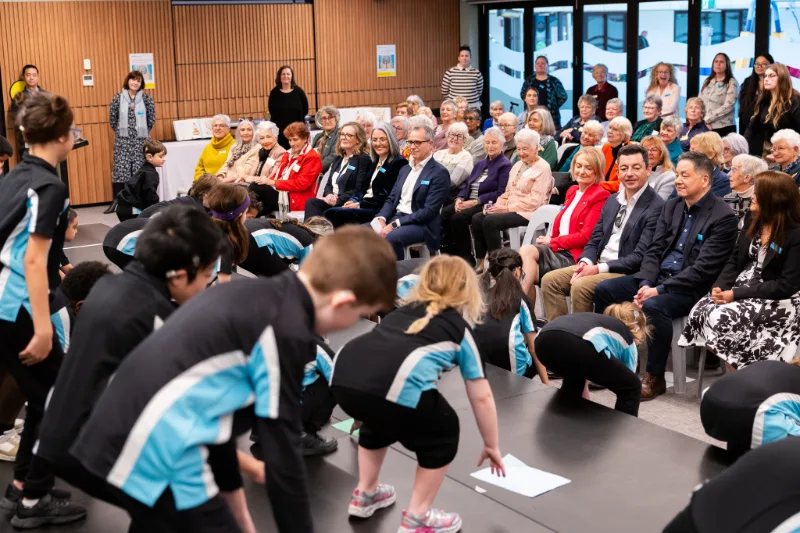 NextSense students performing for Lantern Club members and guests at a community celebration.
