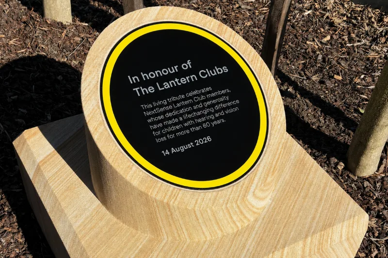 Sandstone plinth and plaque honouring more than 60 years of contributions by the Lantern Clubs to NextSense.